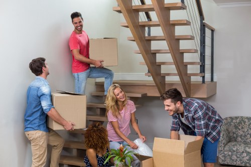 Same day removals team handling boxes and furniture in Edgware
