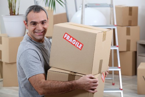 Office relocation team preparing boxes and equipment in Edgware
