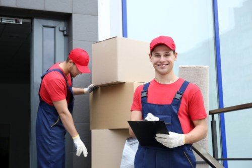 Removal van and moving team preparing a residential move in Edgware