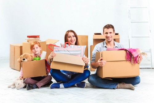 Moving team carrying boxes safely during a removal job