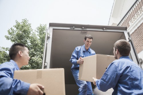 Loading boxes and furniture into a van in Edgware