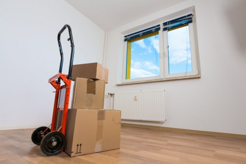 Movers carefully organising items during packing and unpacking in Edgware