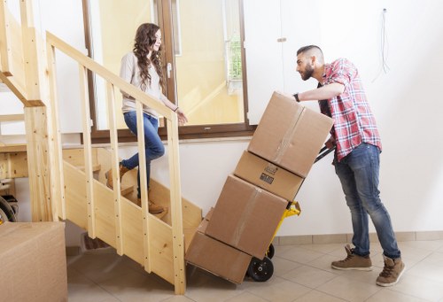 Van delivery service transporting sofas and appliances