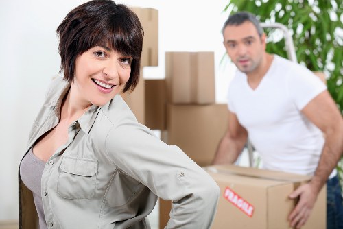 Packed household boxes and furniture ready for residential removals