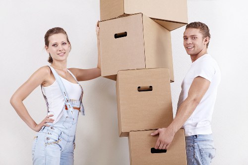 Professional removals team working with protective equipment