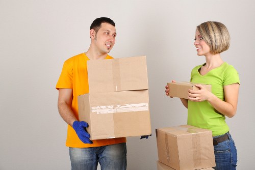 Professional movers loading items for a house move in Edgware