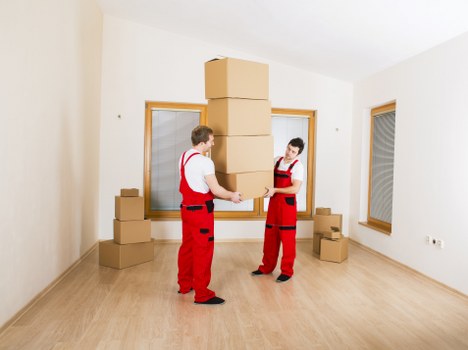 Careful loading of a piano removals vehicle in North West London